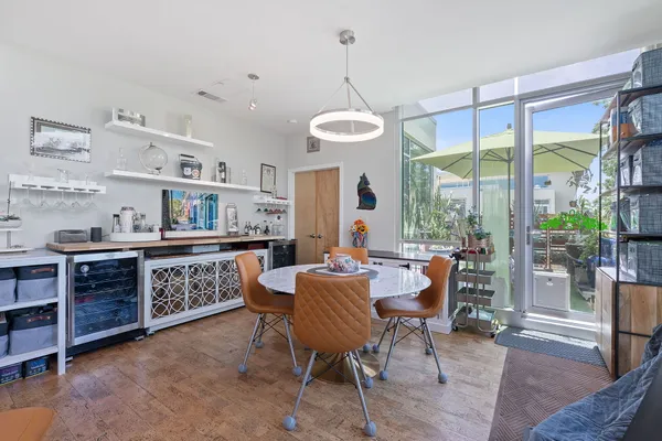 a living room with kitchen island furniture and a large window