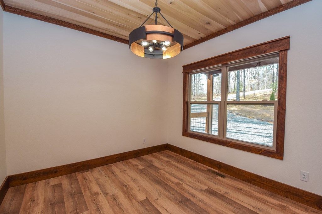 375 Ridge Brook Drive Morganton, GA 30560 - Photo 13 of 34 a view of an empty room with wooden floor and a window