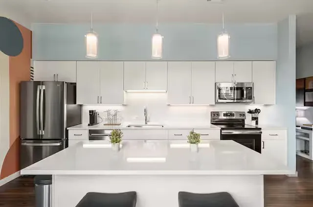 a dining room with a wooden table and chairs