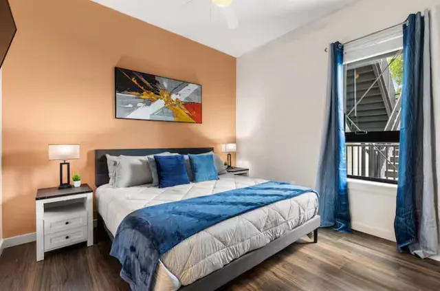 a view of a terrace with furniture and city view