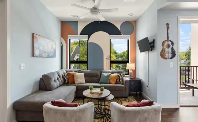 a living room with furniture and a large window