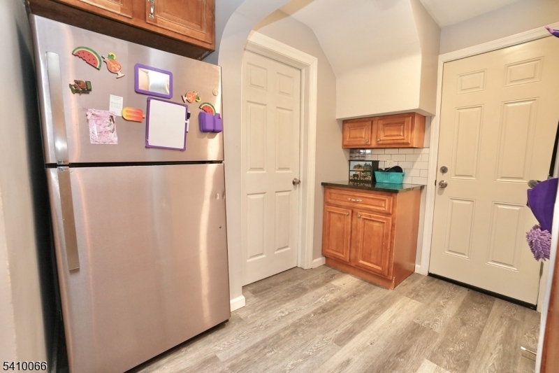 172 Delavan Avenue Newark, NJ 07104 - Photo 13 of 16 a kitchen with stainless steel appliances a refrigerator and a cabinets