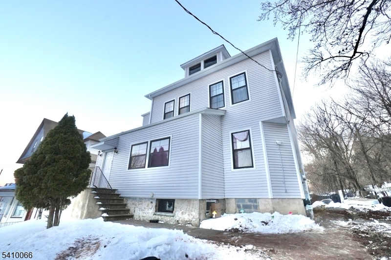 172 Delavan Avenue Newark, NJ 07104 - Photo 16 of 16 a front view of a house with a yard