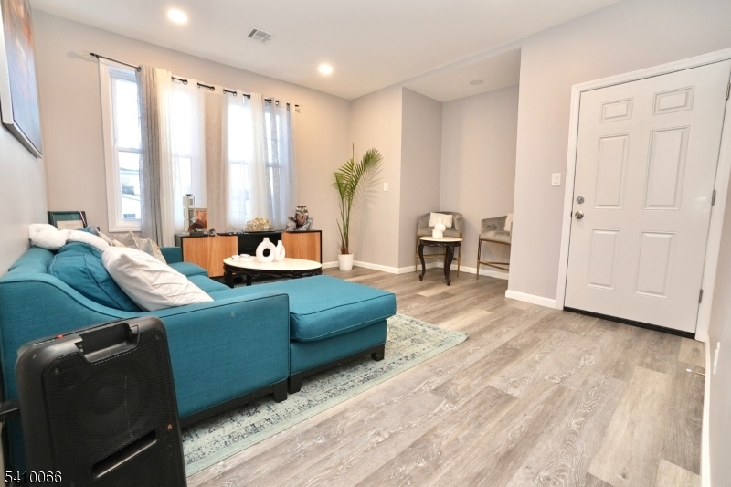 172 Delavan Avenue Newark, NJ 07104 - Photo 3 of 16 a living room with furniture and large windows