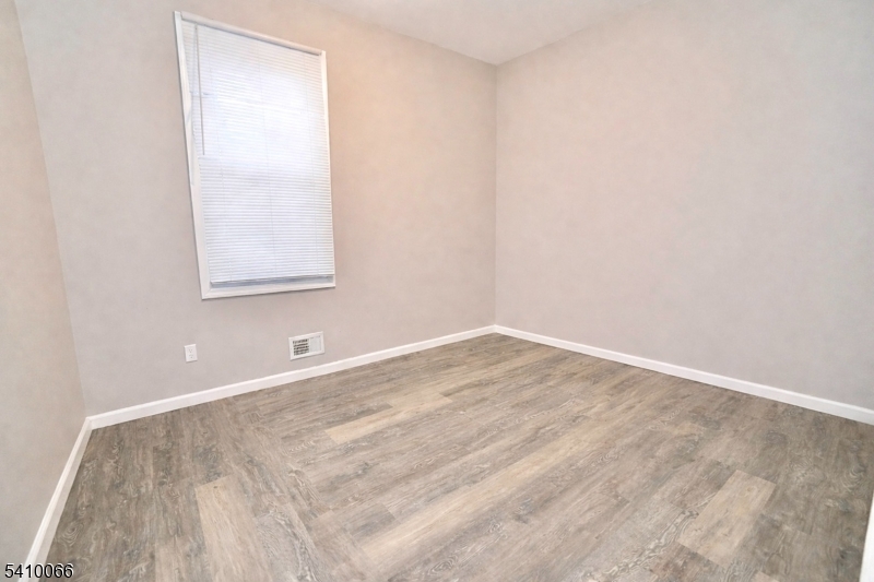 172 Delavan Avenue Newark, NJ 07104 - Photo 6 of 16 an empty room with a window