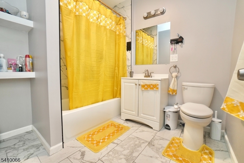 172 Delavan Avenue Newark, NJ 07104 - Photo 8 of 16 a bathroom with a sink toilet and shower
