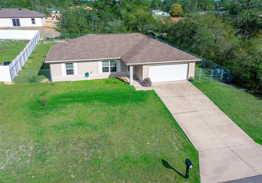 16971 Southwest 43rd Court Road Ocala, FL 34473 - Photo 1 of 1 a aerial view of a house with yard and green space