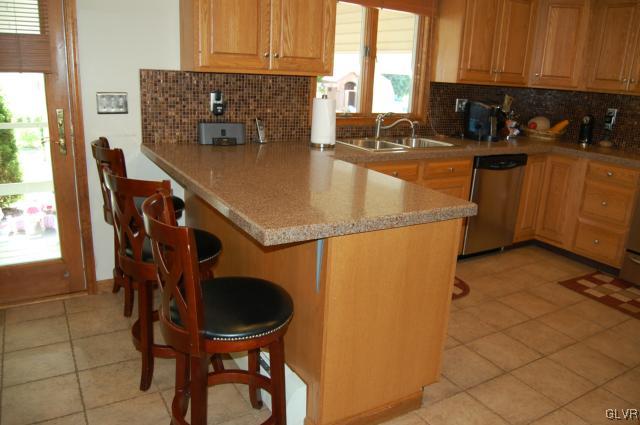 1261 Miller Road Wind Gap, PA 18091 - Photo 11 of 24 a kitchen with a sink a stove and a refrigerator