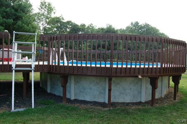 1261 Miller Road Wind Gap, PA 18091 - Photo 20 of 24 a view of a deck with a bench plants and large trees