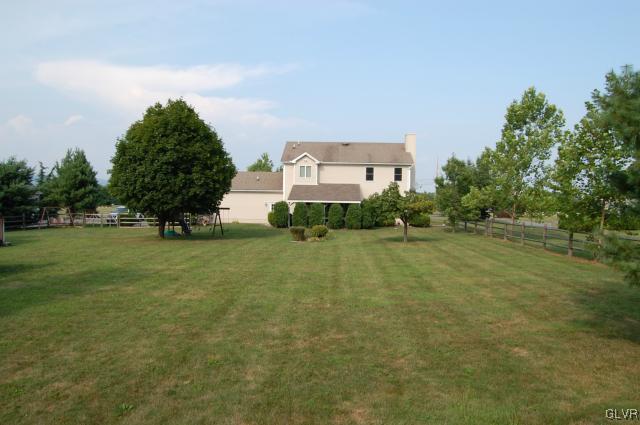 1261 Miller Road Wind Gap, PA 18091 - Photo 21 of 24 a front view of a house with a yard