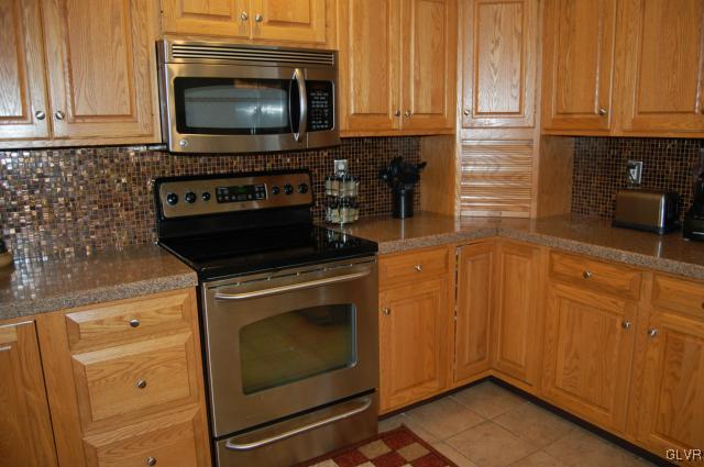 1261 Miller Road Wind Gap, PA 18091 - Photo 5 of 24 a kitchen with microwave stove and cabinets