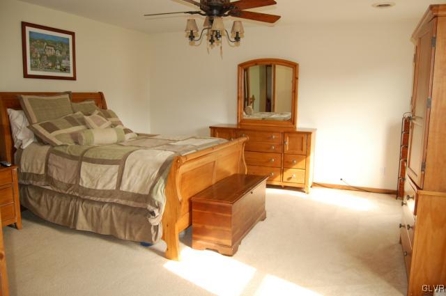 1261 Miller Road Wind Gap, PA 18091 - Photo 7 of 24 a spacious bedroom with a bed and ceiling fan