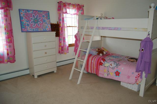 1261 Miller Road Wind Gap, PA 18091 - Photo 8 of 24 a bedroom with a bed and a window