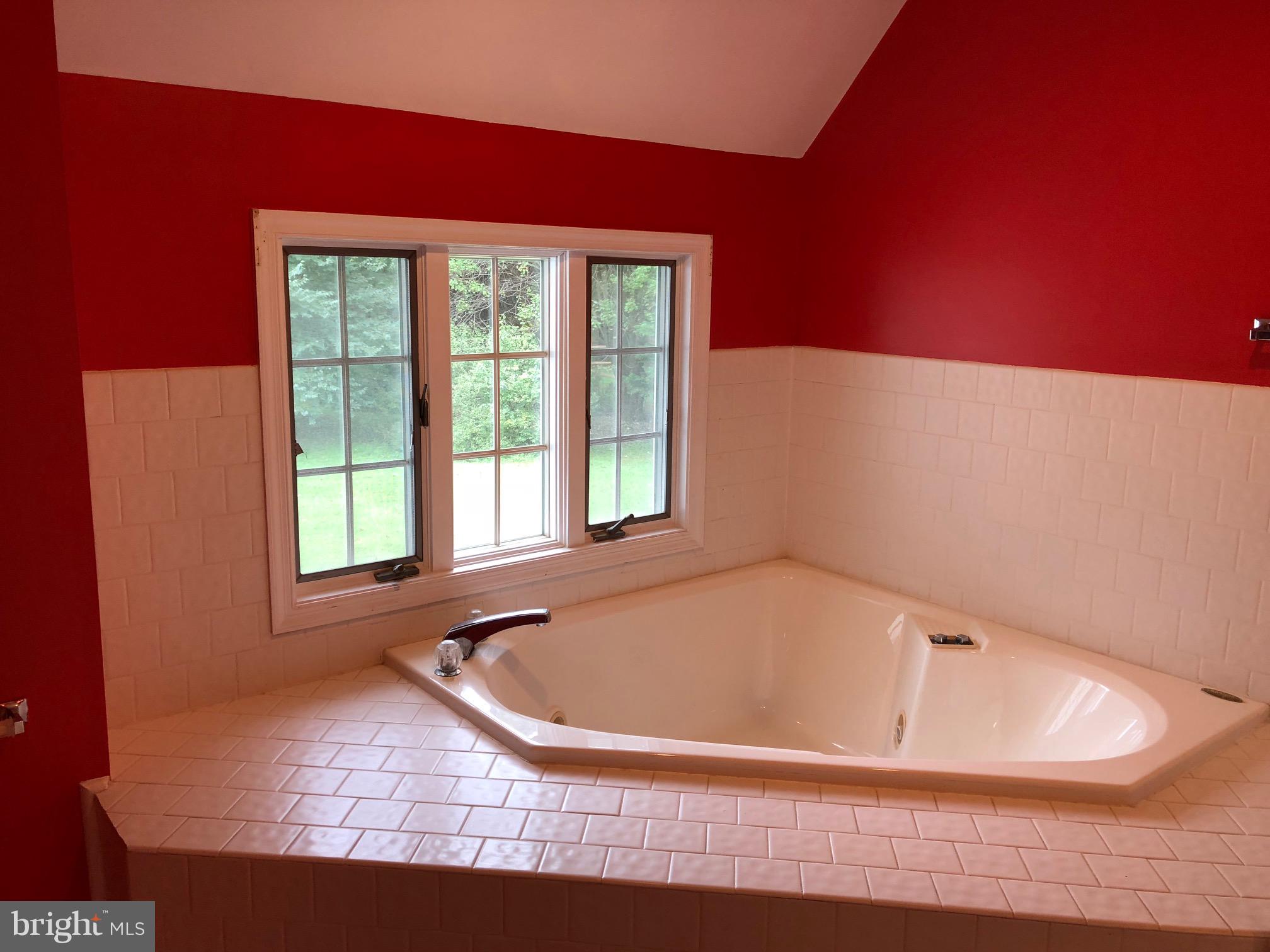 4333 Sweet Air Road Baldwin, MD 21013 - Photo 16 of 28 a bathroom with bathtub and window