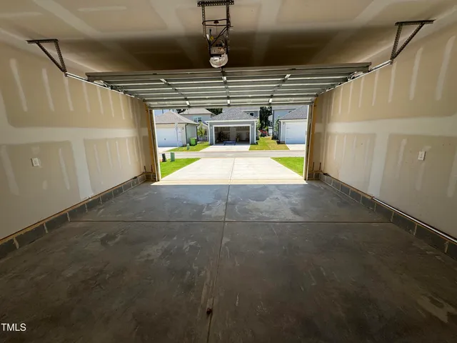 a view of storage and utility room with racks on the wall