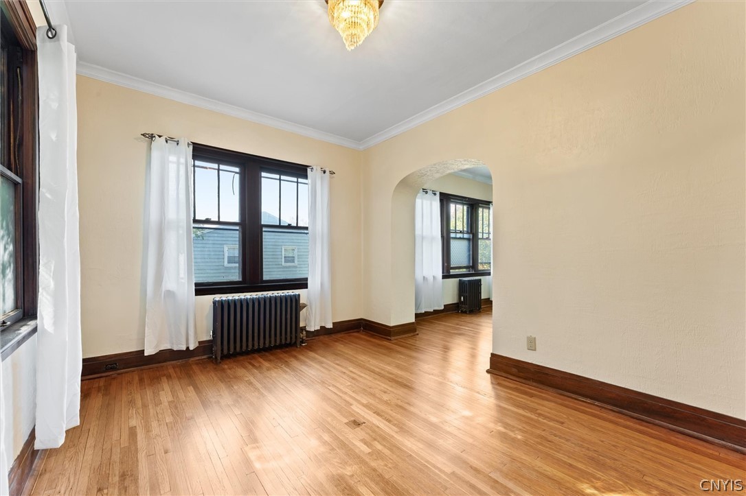 303 Barrington Road, Unit 5 Syracuse, NY 13214 - Photo 10 of 44 Large windows and striking chandeliers are feature