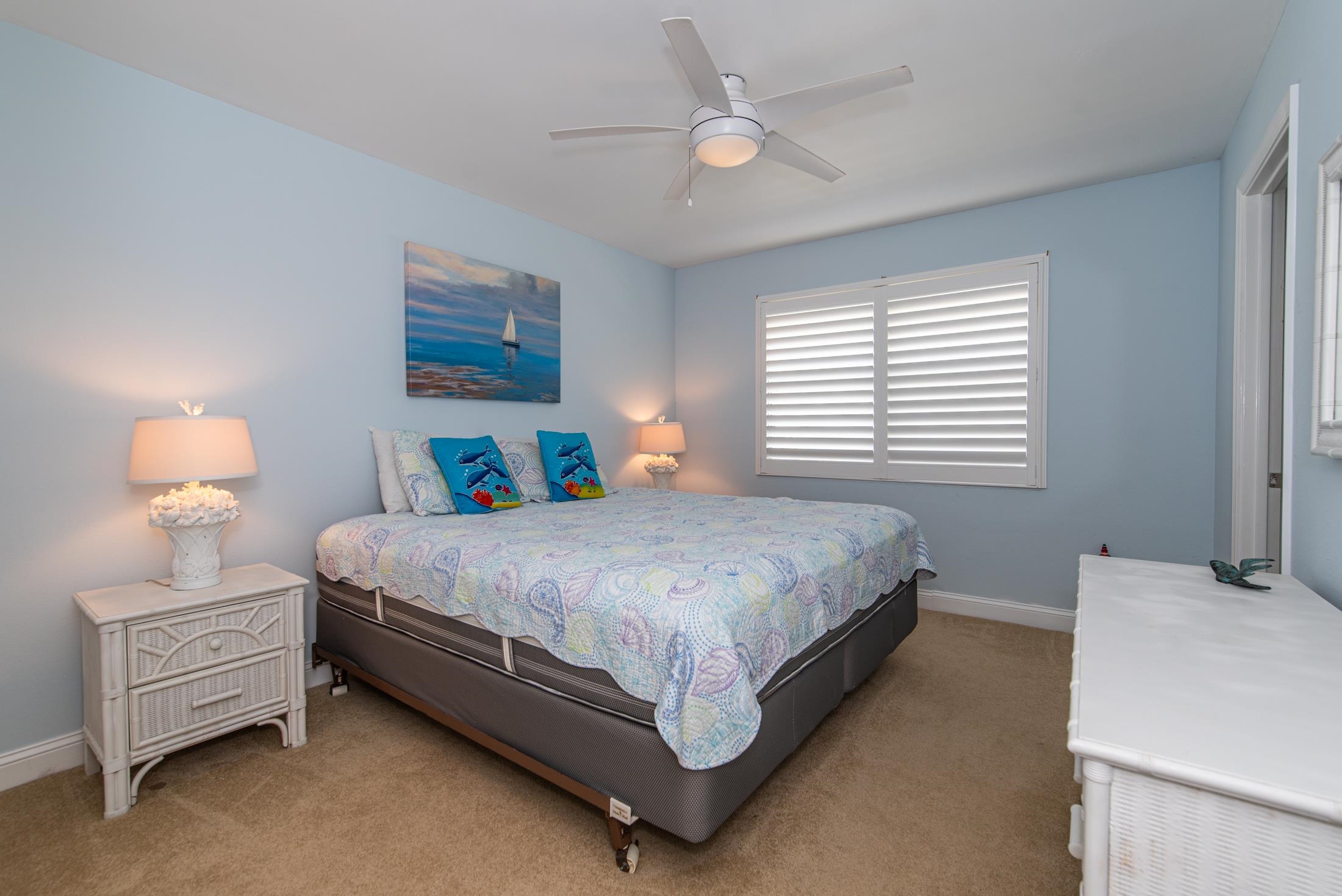 126 Rio Del Mar Street, Unit B St. Augustine, FL 32080 - Photo 11 of 24 a bedroom with a bed and a window