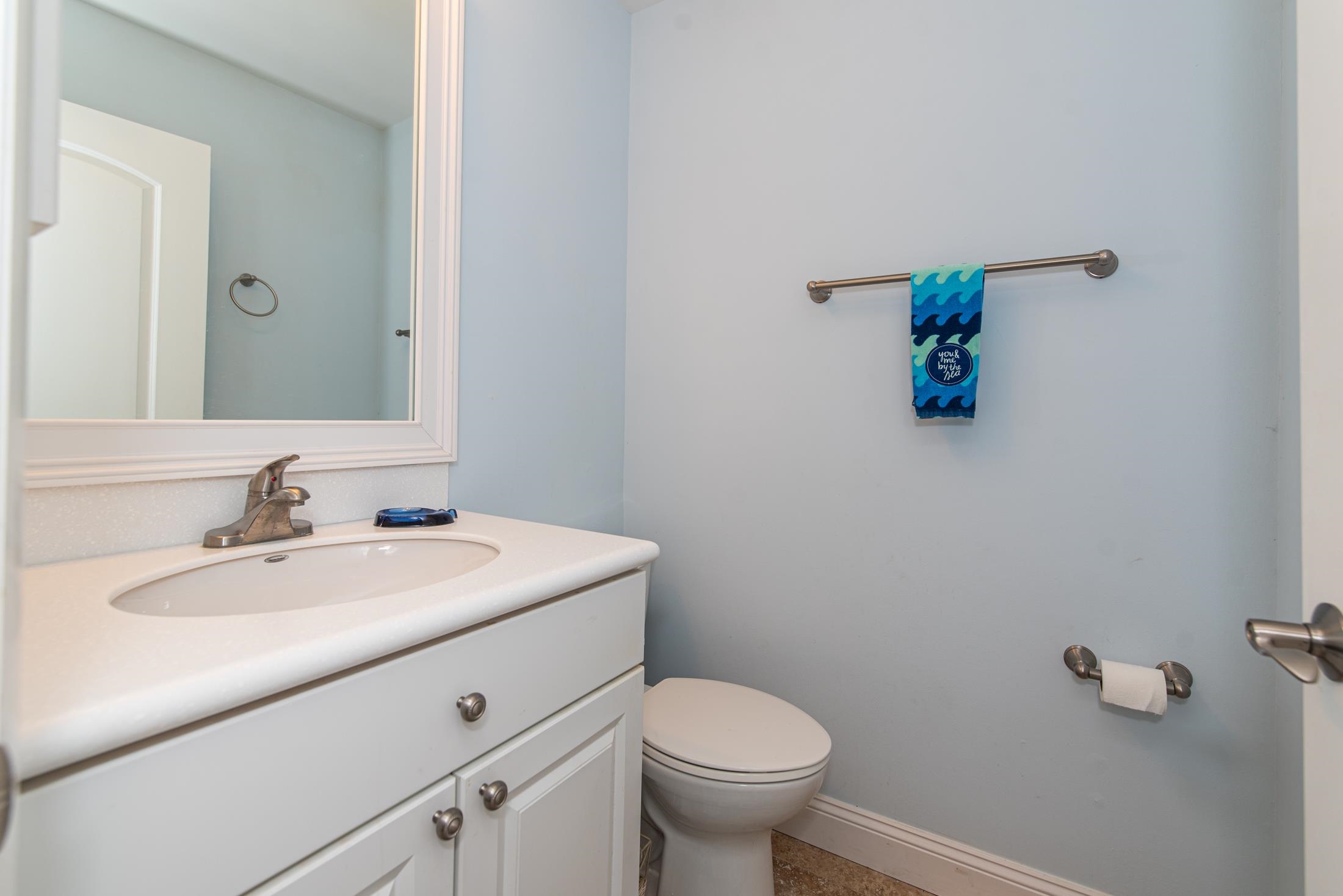 126 Rio Del Mar Street, Unit B St. Augustine, FL 32080 - Photo 13 of 24 a bathroom with a sink toilet and mirror