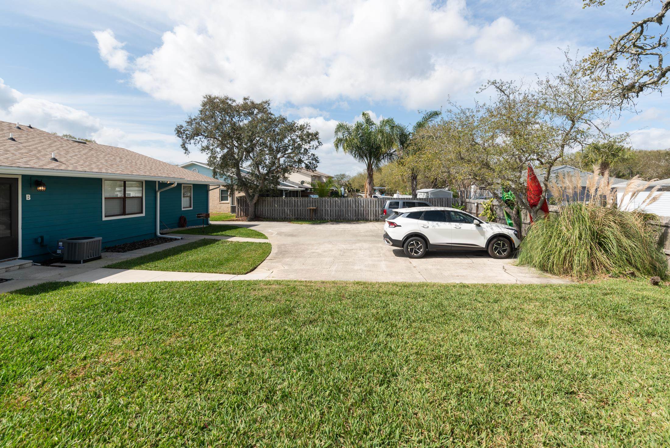126 Rio Del Mar Street, Unit B St. Augustine, FL 32080 - Photo 21 of 24 a view of street with parked cars