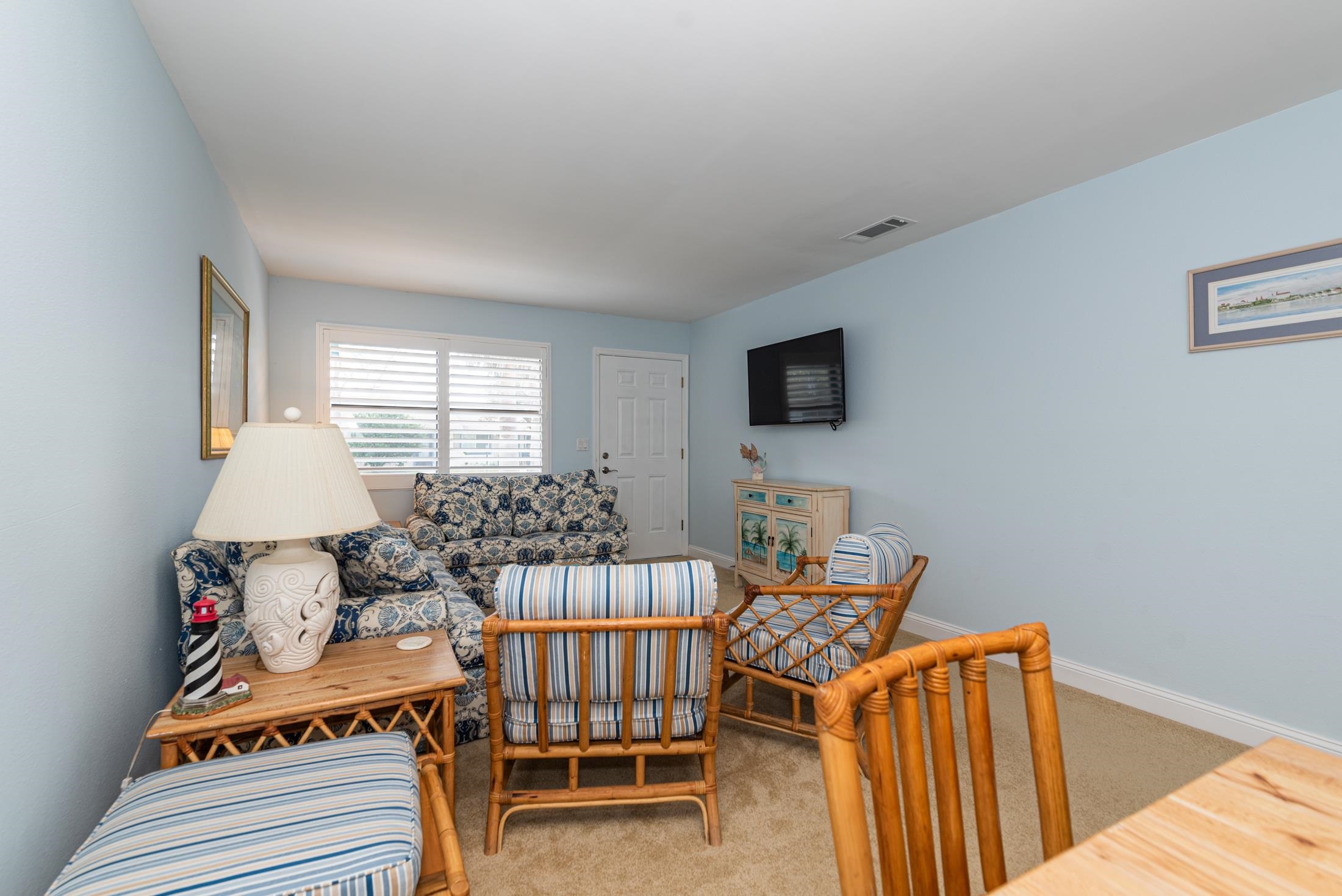 126 Rio Del Mar Street, Unit B St. Augustine, FL 32080 - Photo 5 of 24 a bedroom with furniture and a window