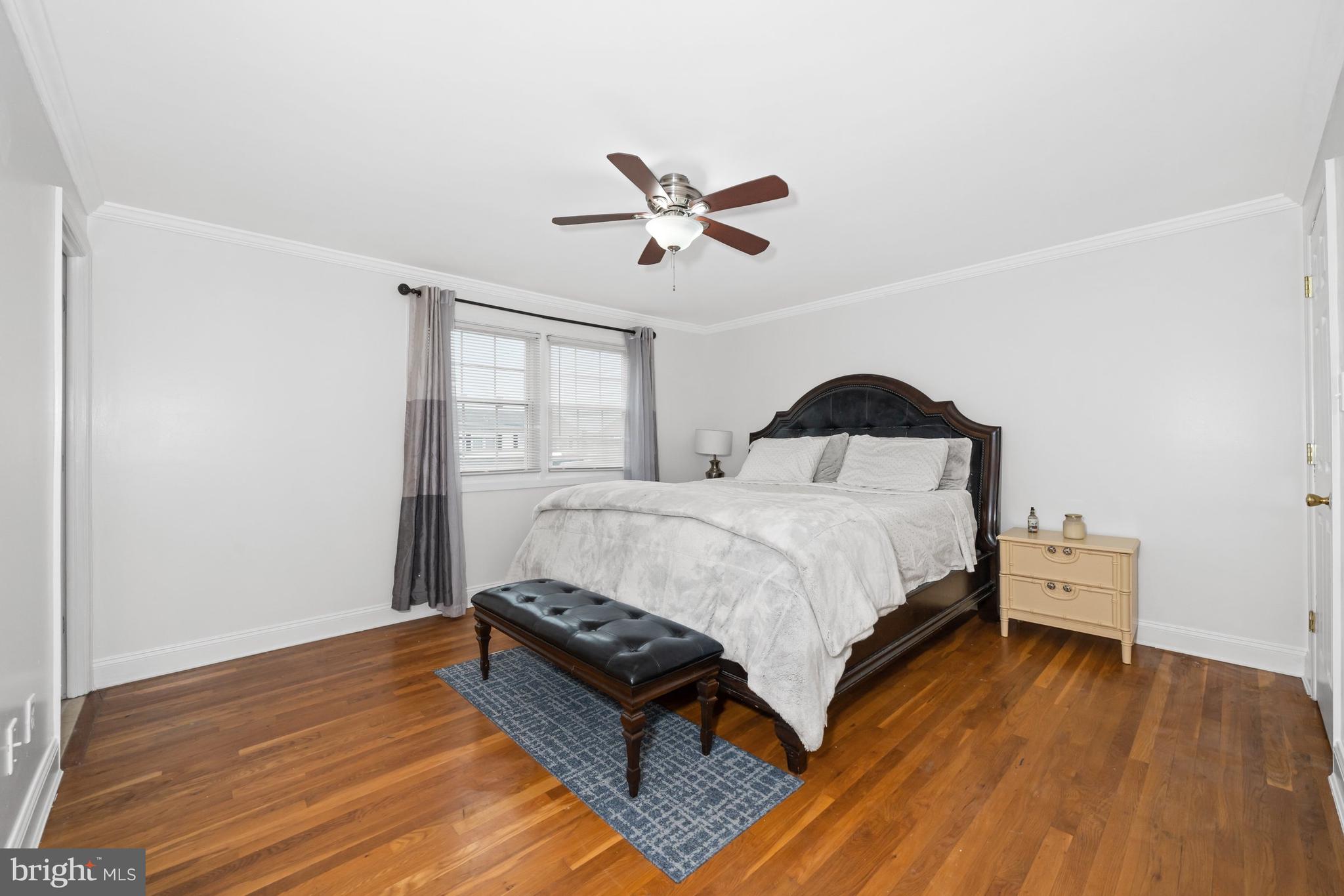 18 George Read Road New Castle, DE 19720 - Photo 28 of 40 a bedroom with a bed and wooden floor