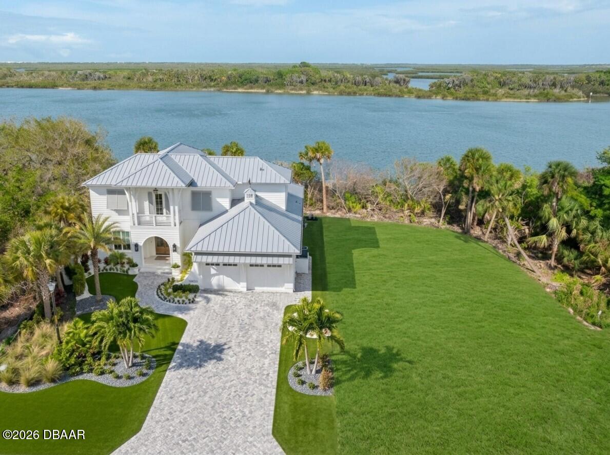 183 Jones Fish Camp Road Edgewater, FL 32141 - Photo 11 of 11 a front view of a house with a yard and lake view