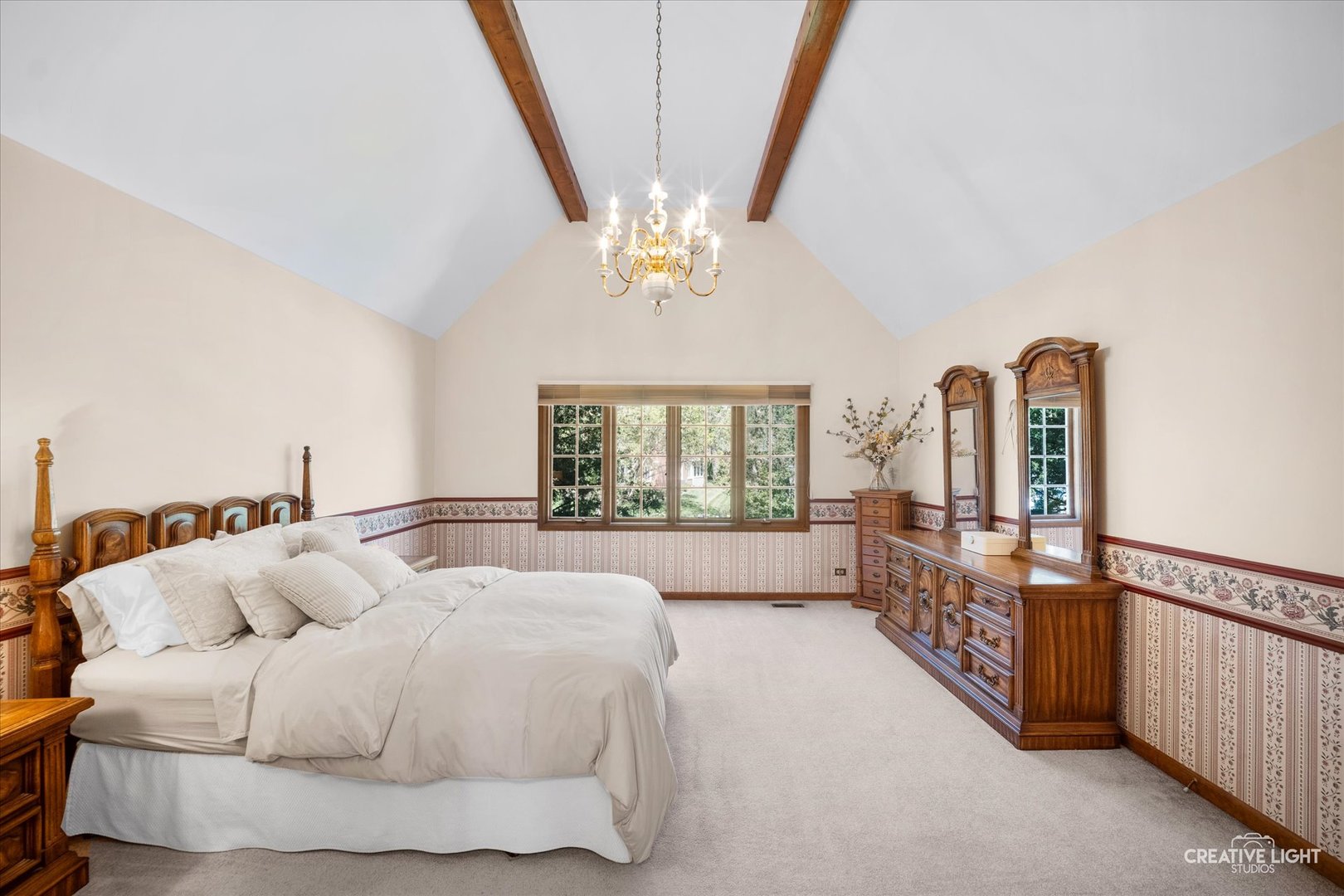 3112 Turnberry Road St. Charles, IL 60174 - Photo 22 of 43 a spacious bedroom with a bed a couch and a large window