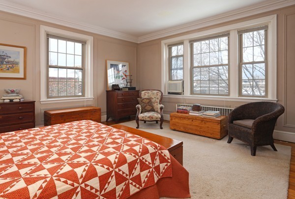 1258 Beacon Street, Unit 7 Brookline, MA 02446 - Photo 6 of 6 a bedroom with a bed and a couch next to a window