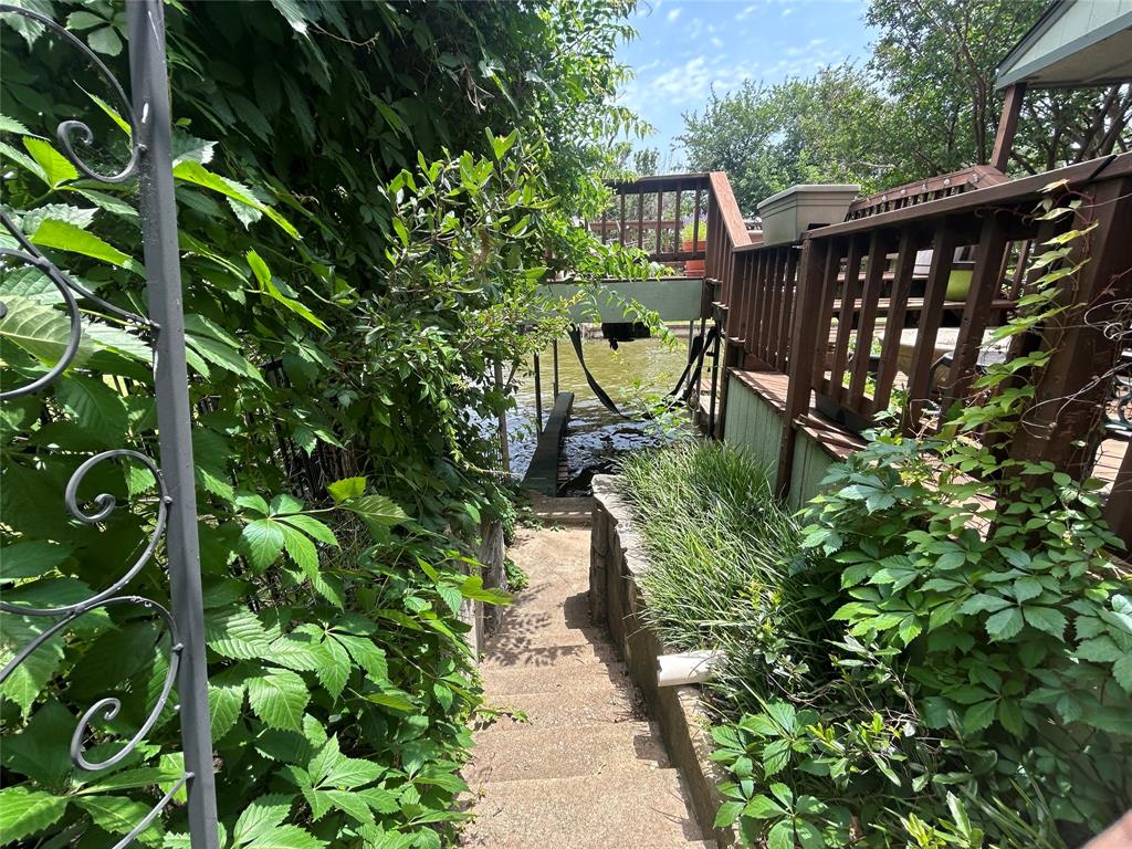 696 Harbor Drive North Azle, TX 76020 - Photo 11 of 40 a backyard of a house with lots of green space