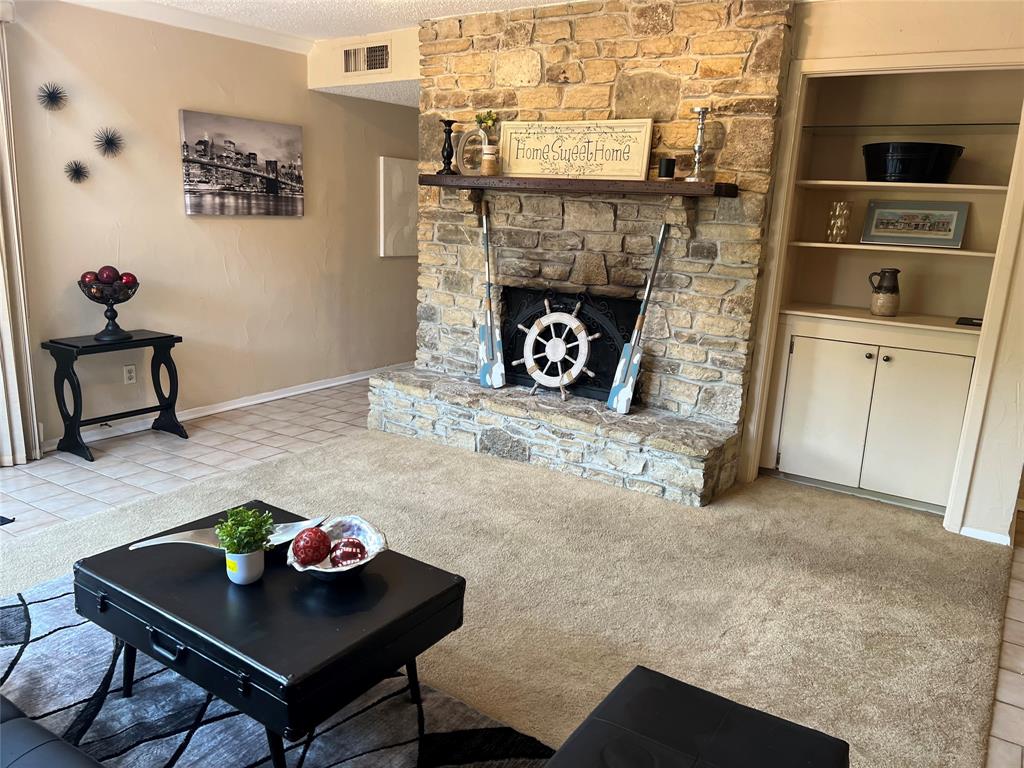 696 Harbor Drive North Azle, TX 76020 - Photo 18 of 40 a living room with furniture and a fireplace