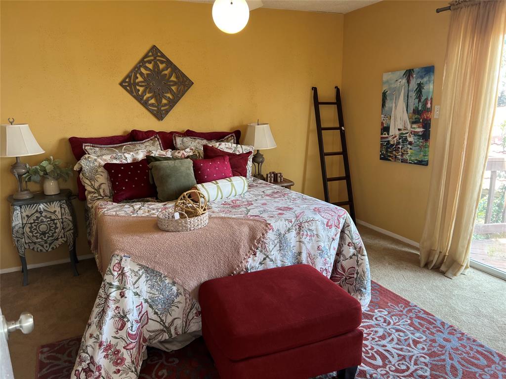 696 Harbor Drive North Azle, TX 76020 - Photo 33 of 40 a bed sitting in a bedroom next to a window