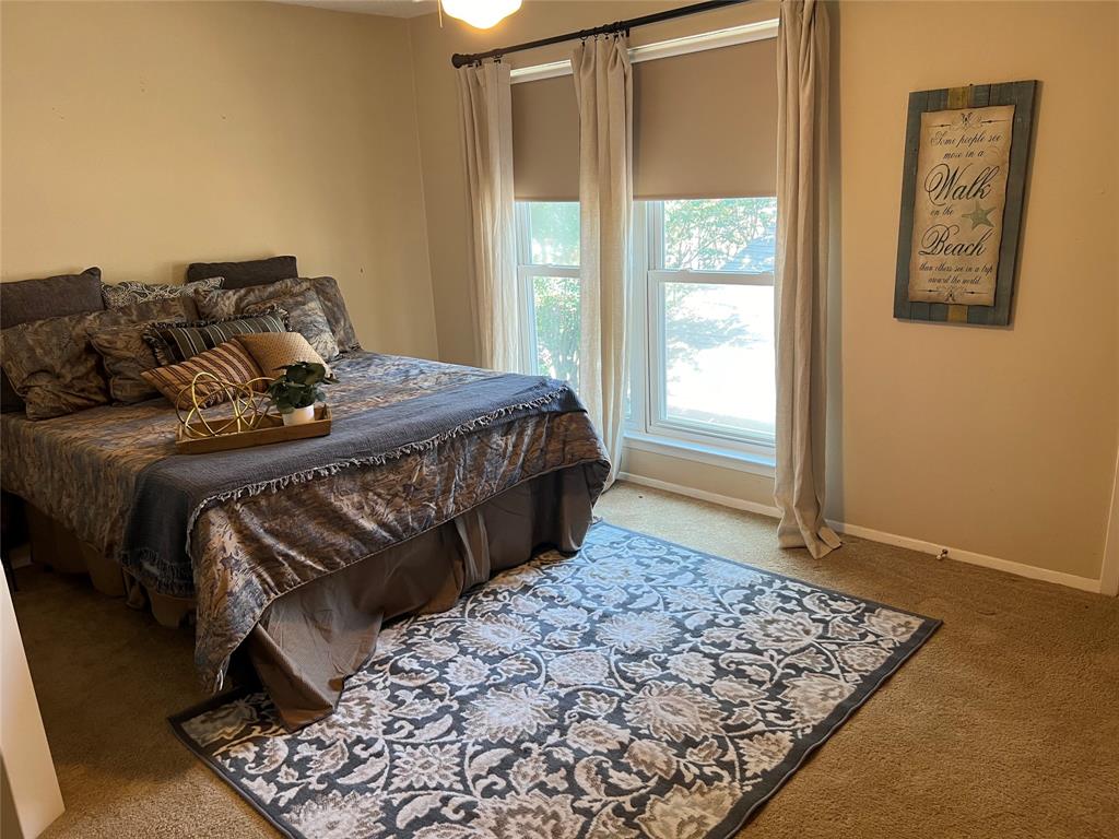 696 Harbor Drive North Azle, TX 76020 - Photo 37 of 40 a bedroom with a bed and window