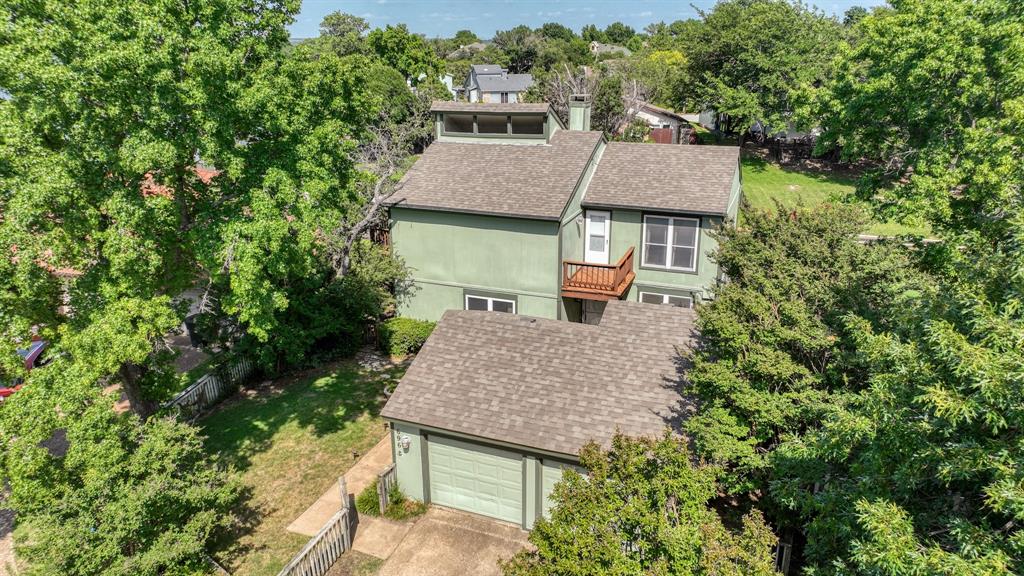 696 Harbor Drive North Azle, TX 76020 - Photo 4 of 40 an aerial view of a house with yard and trees in the background