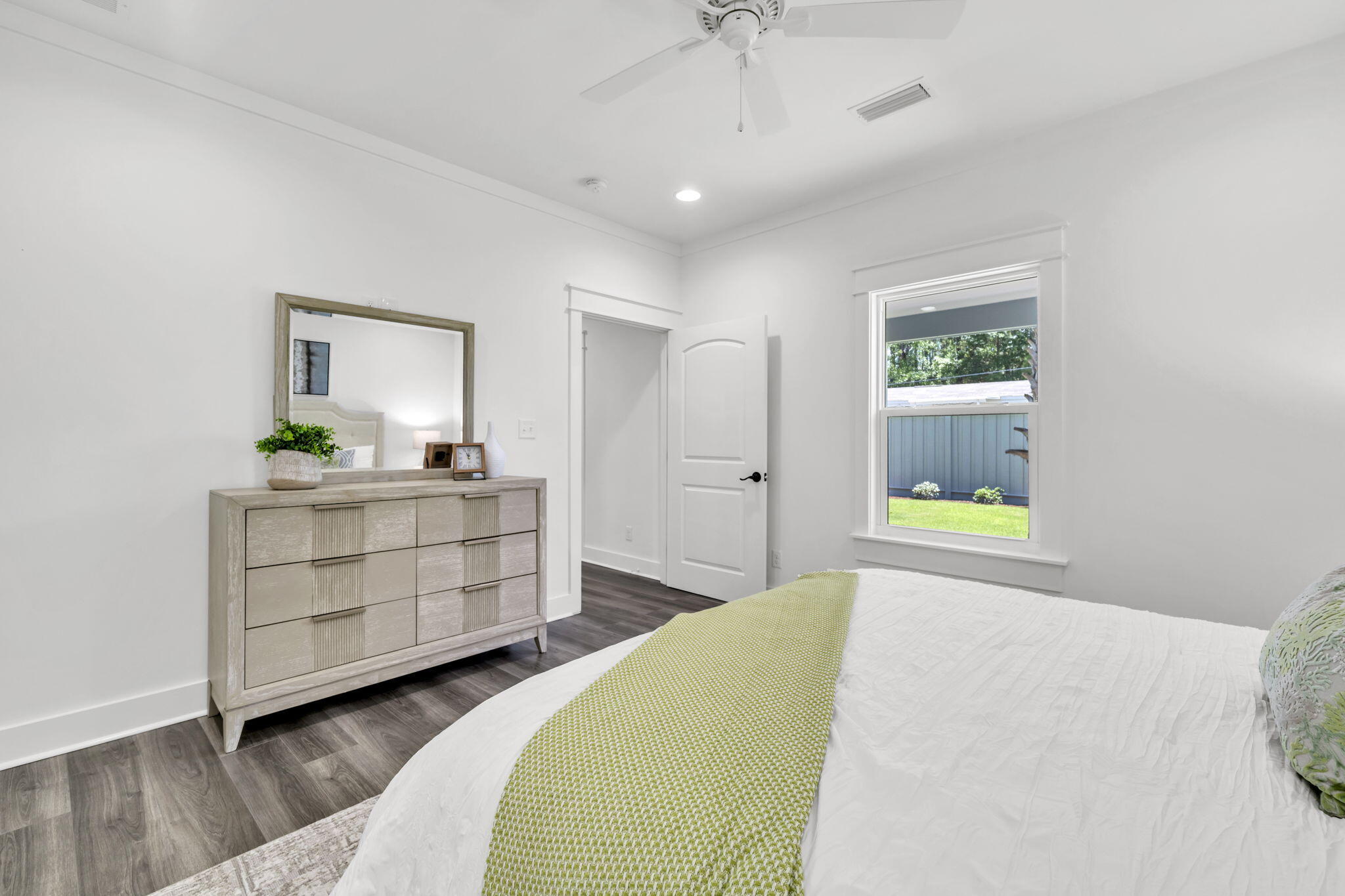 2672 Chat Holley Road Santa Rosa Beach, FL 32459 - Photo 12 of 53 a bedroom with a bed and a dresser in it