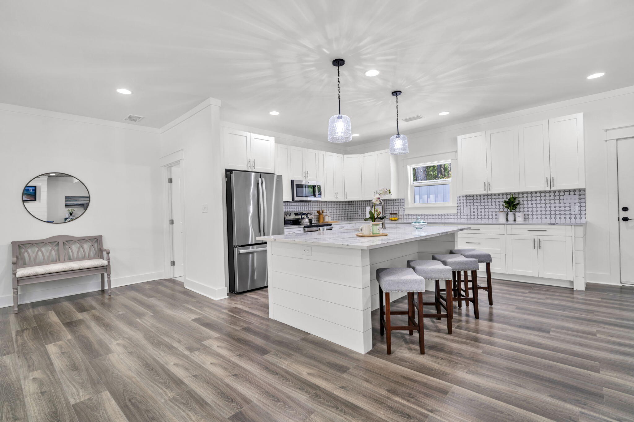 2672 Chat Holley Road Santa Rosa Beach, FL 32459 - Photo 15 of 53 a kitchen with refrigerator cabinets and wooden floor