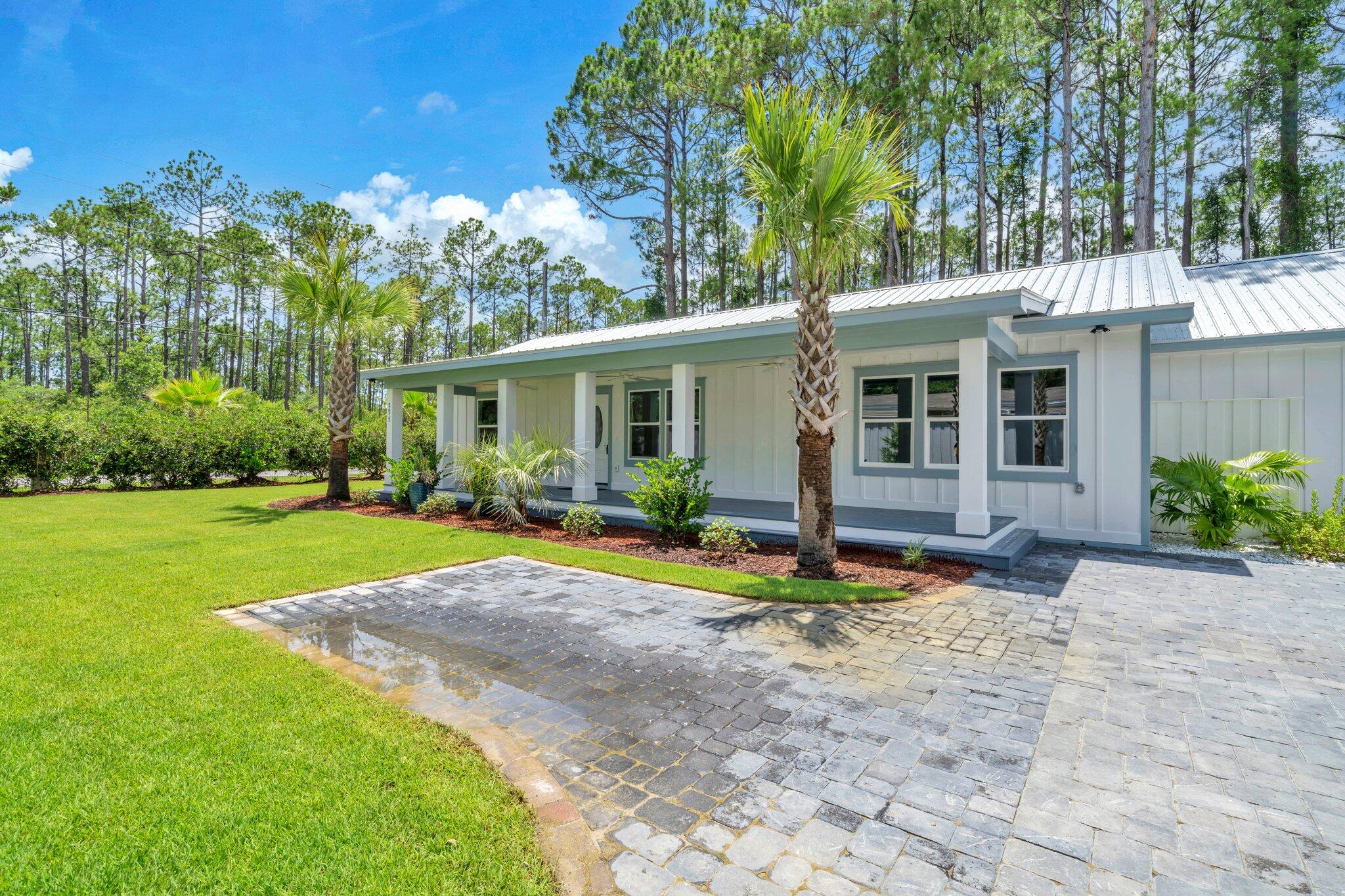 2672 Chat Holley Road Santa Rosa Beach, FL 32459 - Photo 2 of 53 a view of a house with backyard and sitting area