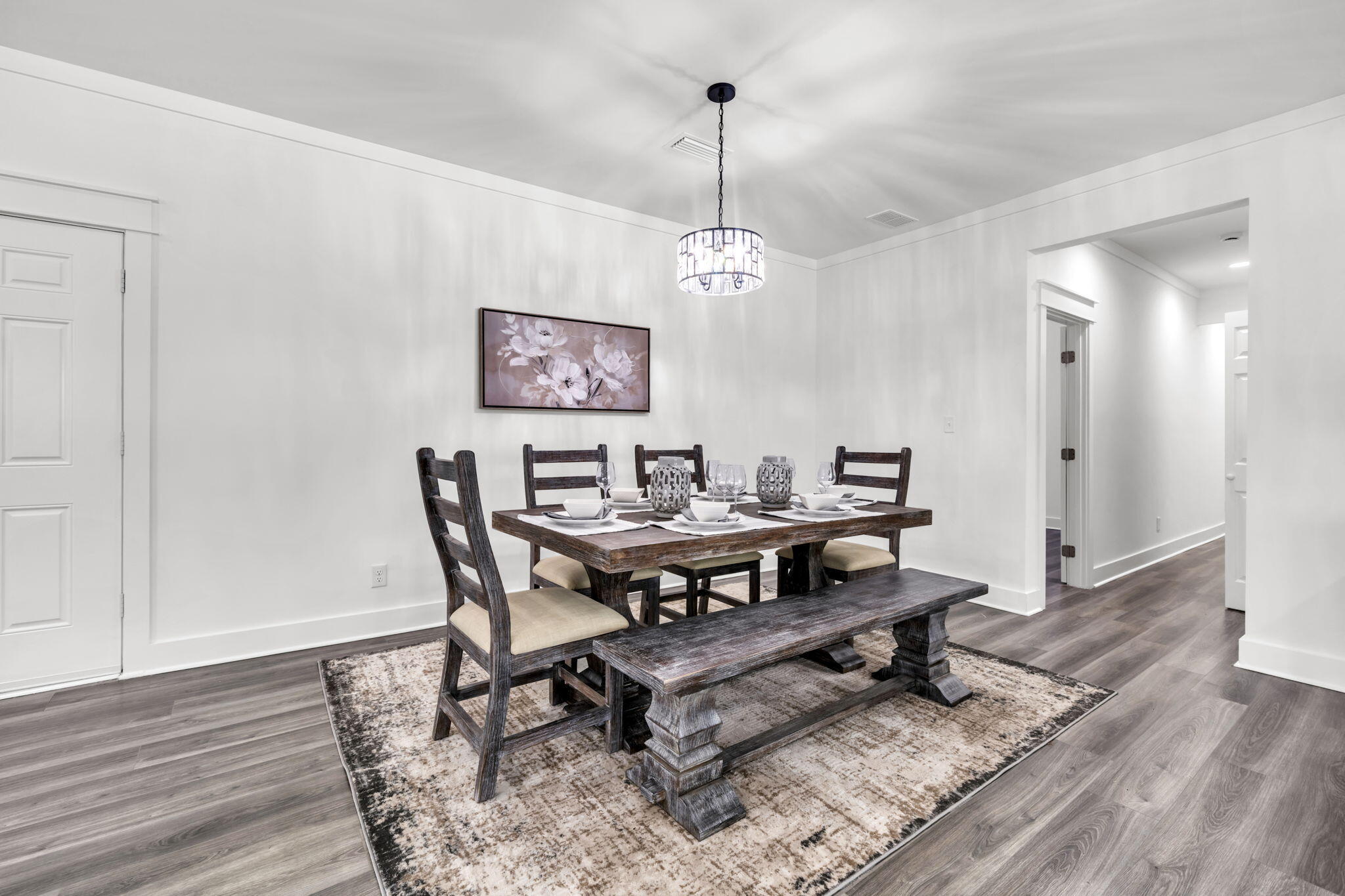 2672 Chat Holley Road Santa Rosa Beach, FL 32459 - Photo 21 of 53 a view of a dining room with furniture wooden floor and a chandelier
