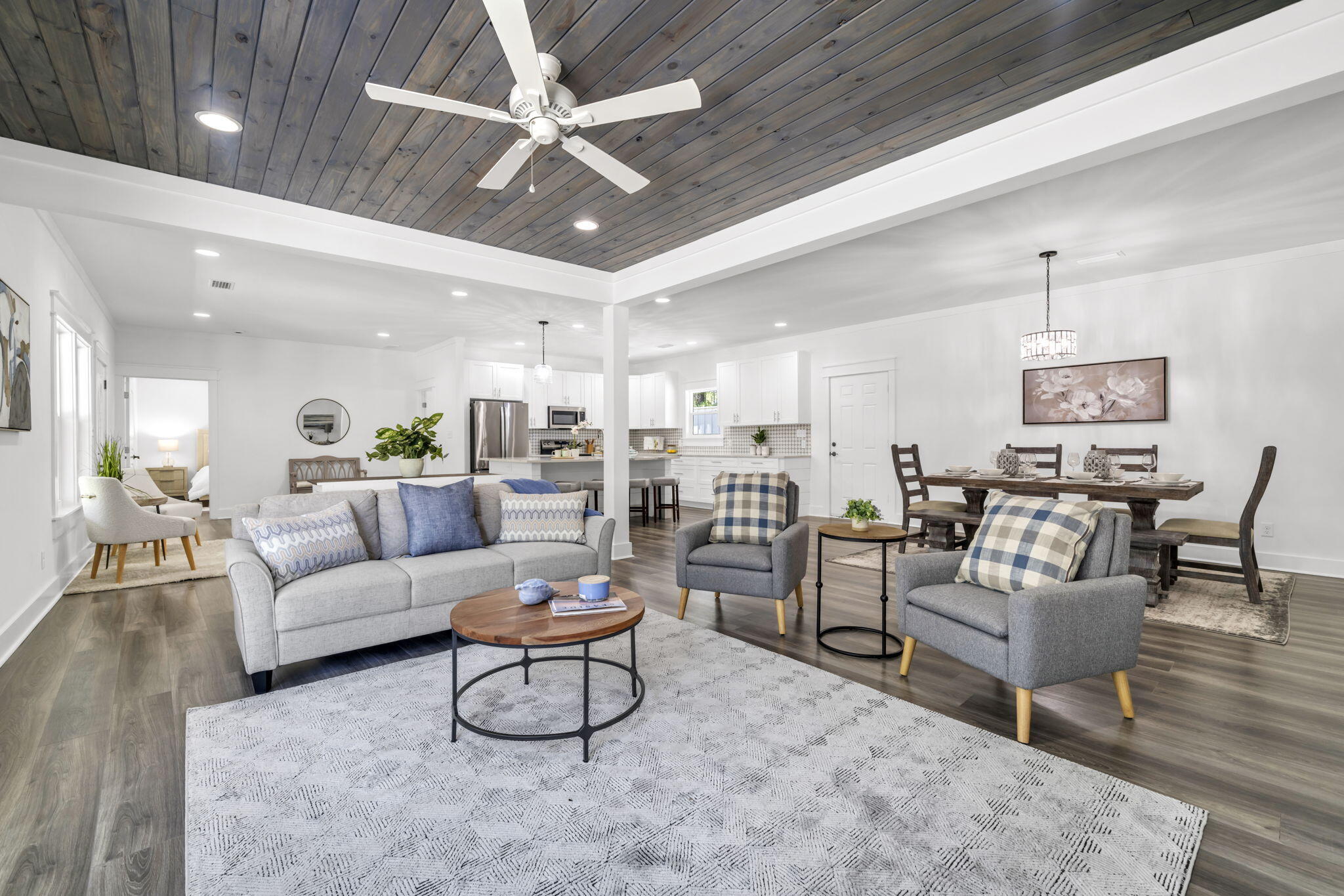 2672 Chat Holley Road Santa Rosa Beach, FL 32459 - Photo 25 of 53 a living room with furniture kitchen view and a chandelier