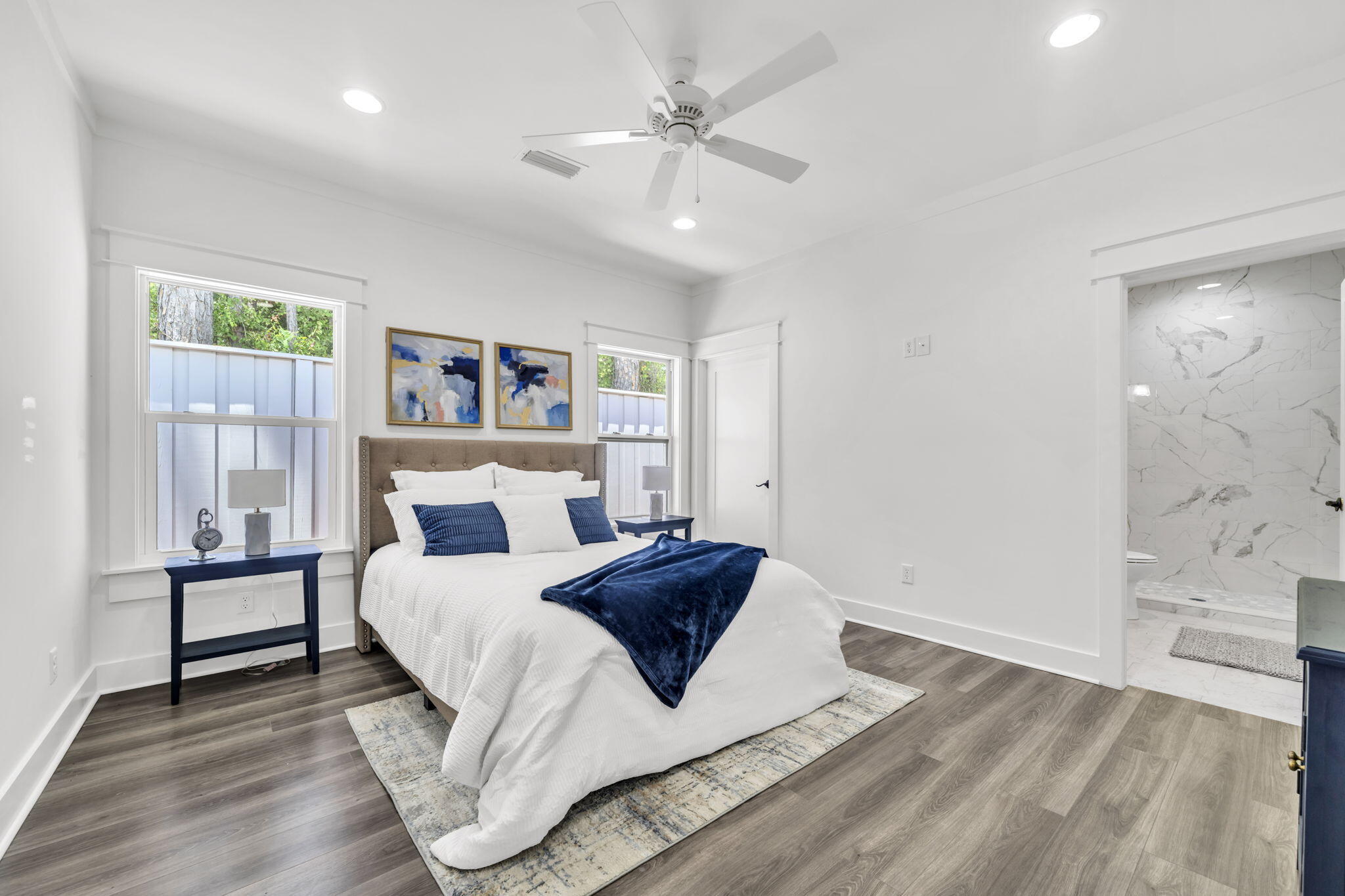 2672 Chat Holley Road Santa Rosa Beach, FL 32459 - Photo 26 of 53 a bedroom with a large bed and a chandelier