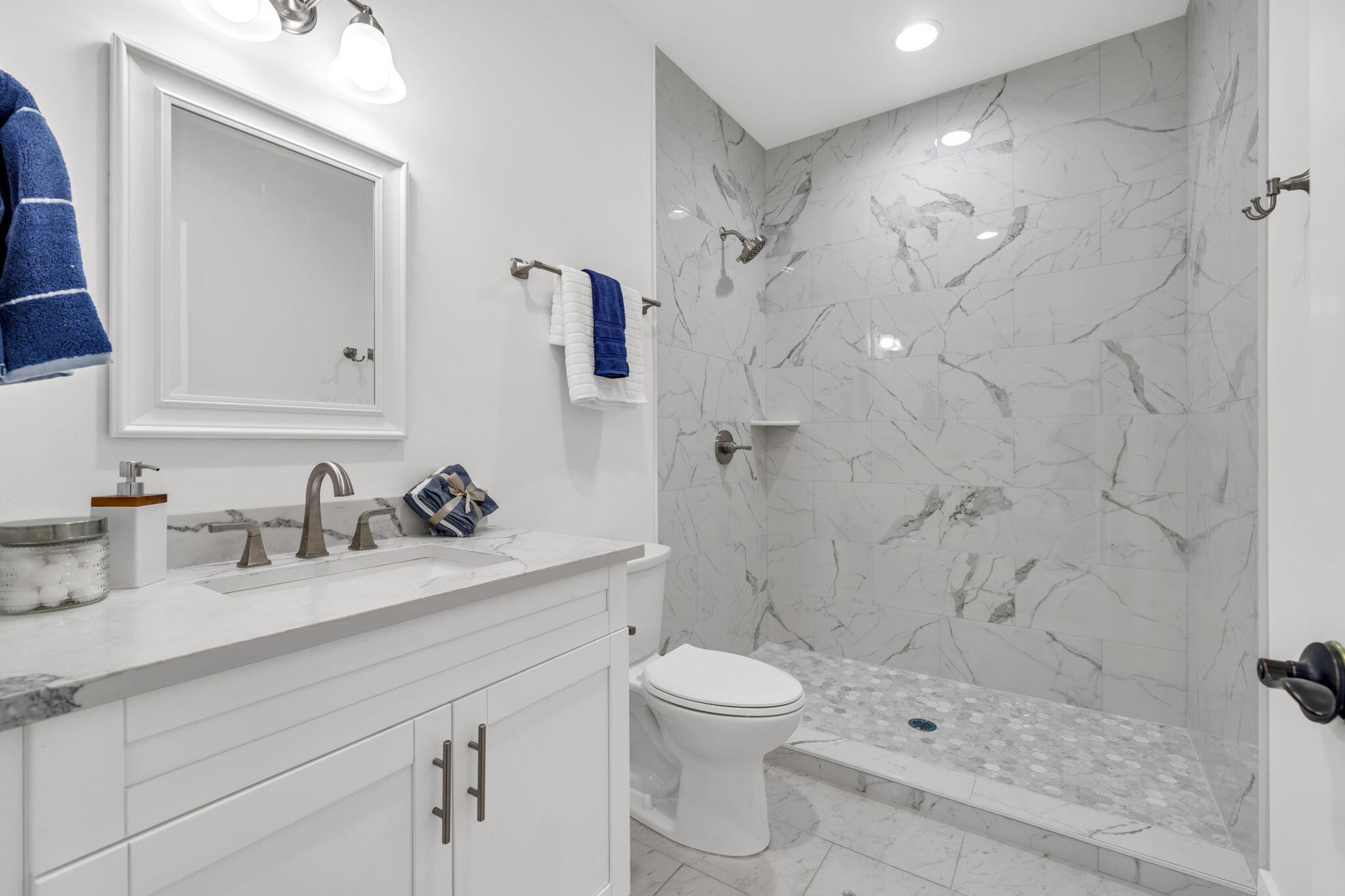 2672 Chat Holley Road Santa Rosa Beach, FL 32459 - Photo 28 of 53 a bathroom with a sink toilet a mirror and shower