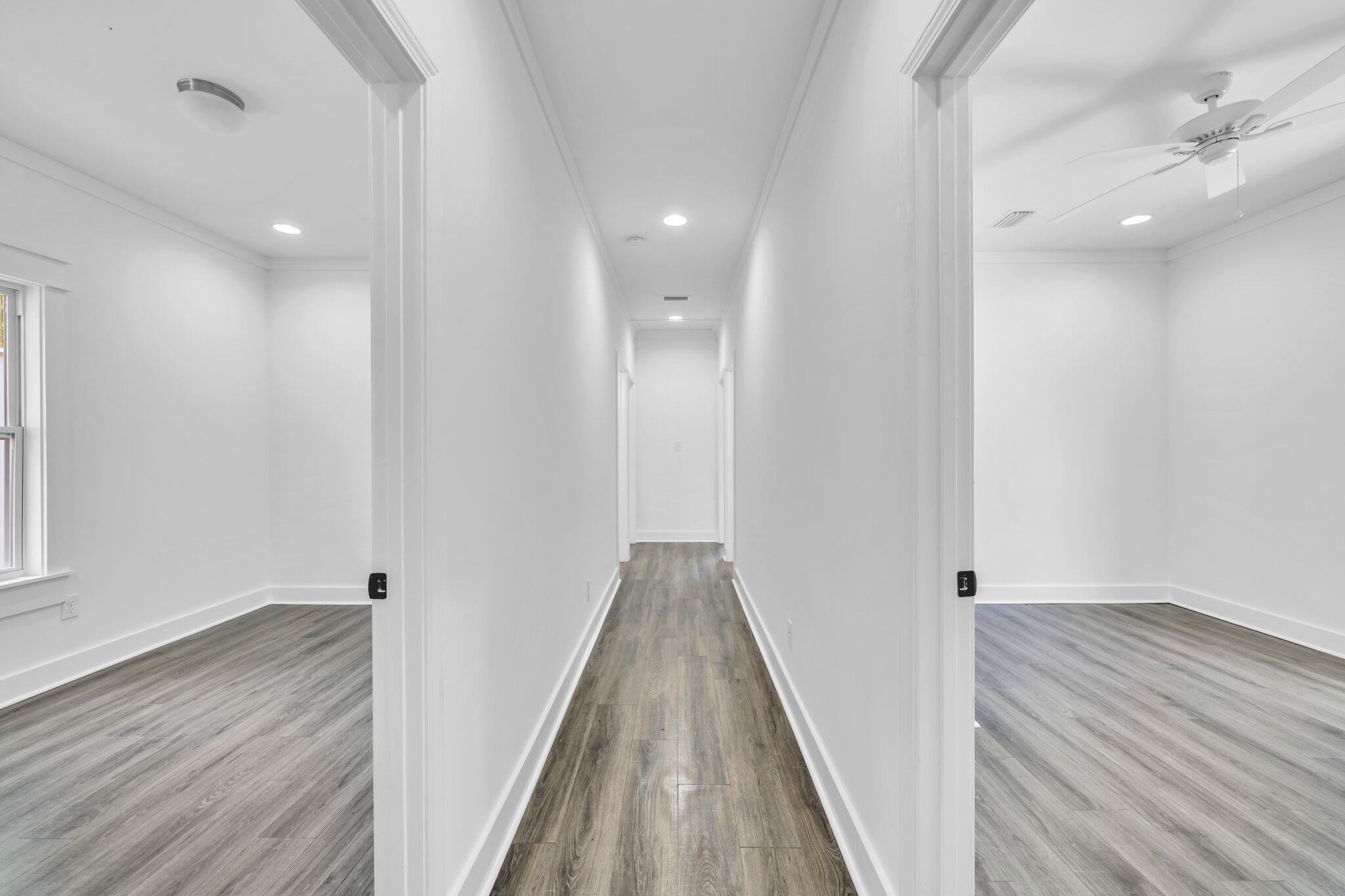 2672 Chat Holley Road Santa Rosa Beach, FL 32459 - Photo 33 of 53 a view of hallway with wooden floor
