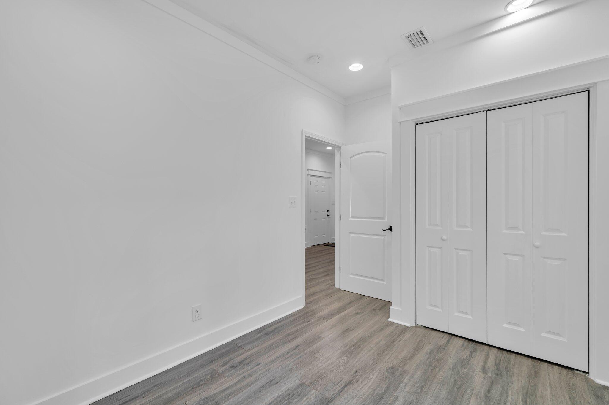 2672 Chat Holley Road Santa Rosa Beach, FL 32459 - Photo 35 of 53 a view of an empty room with wooden floor