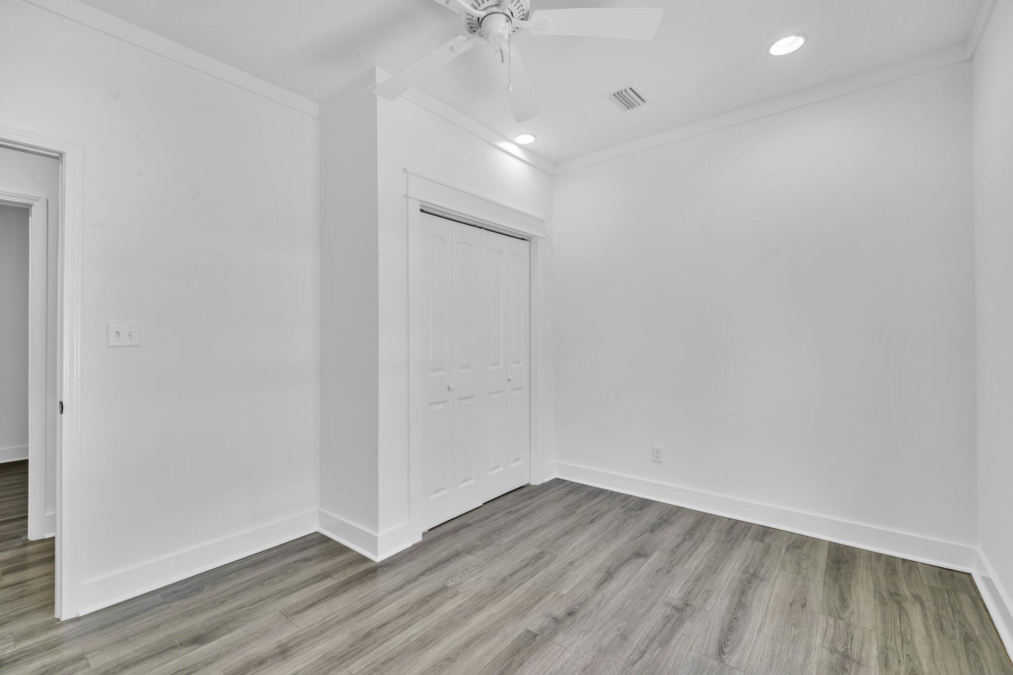 2672 Chat Holley Road Santa Rosa Beach, FL 32459 - Photo 43 of 53 a view of an empty room with wooden floor