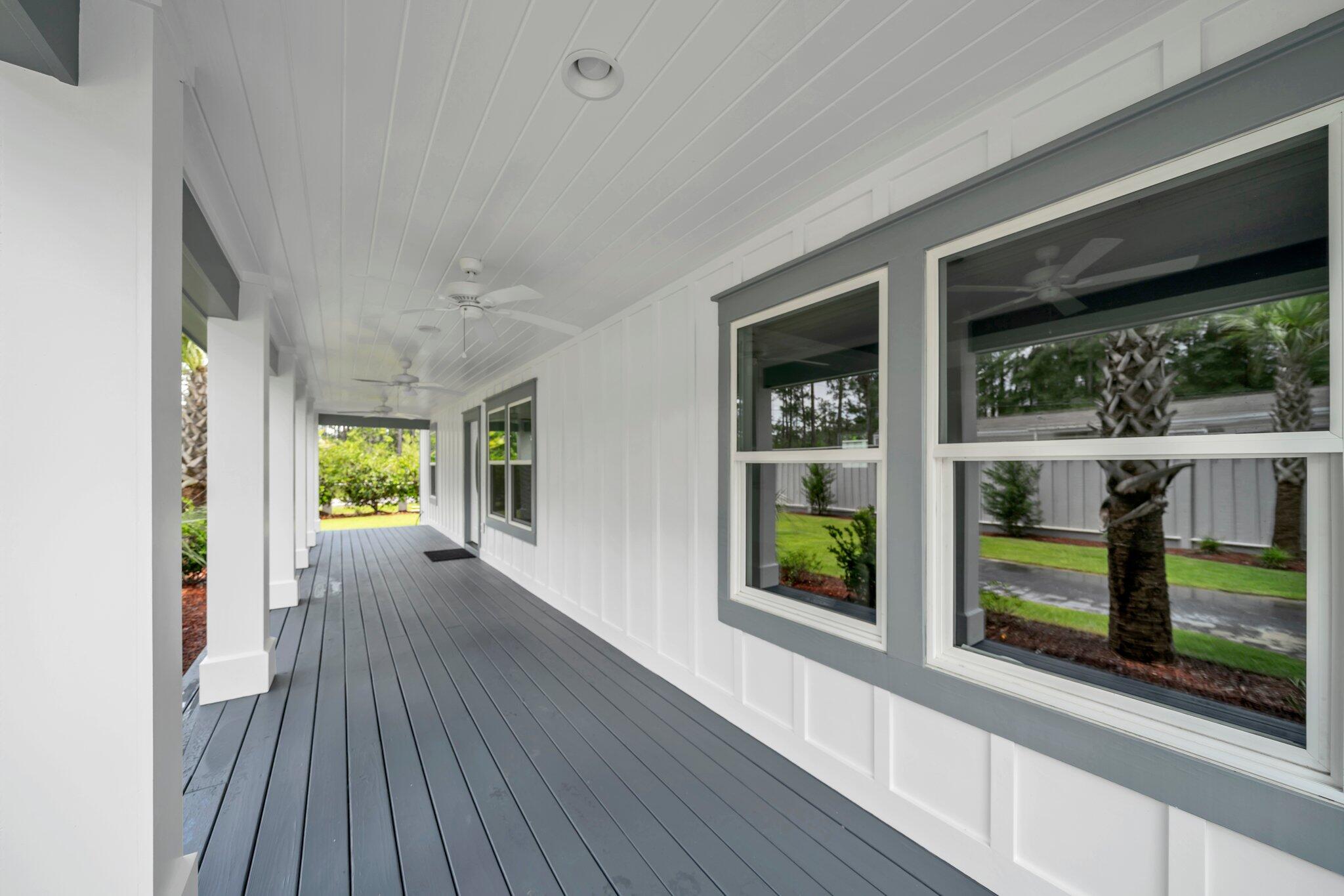 2672 Chat Holley Road Santa Rosa Beach, FL 32459 - Photo 7 of 53 a view of a house with porch and wooden floor