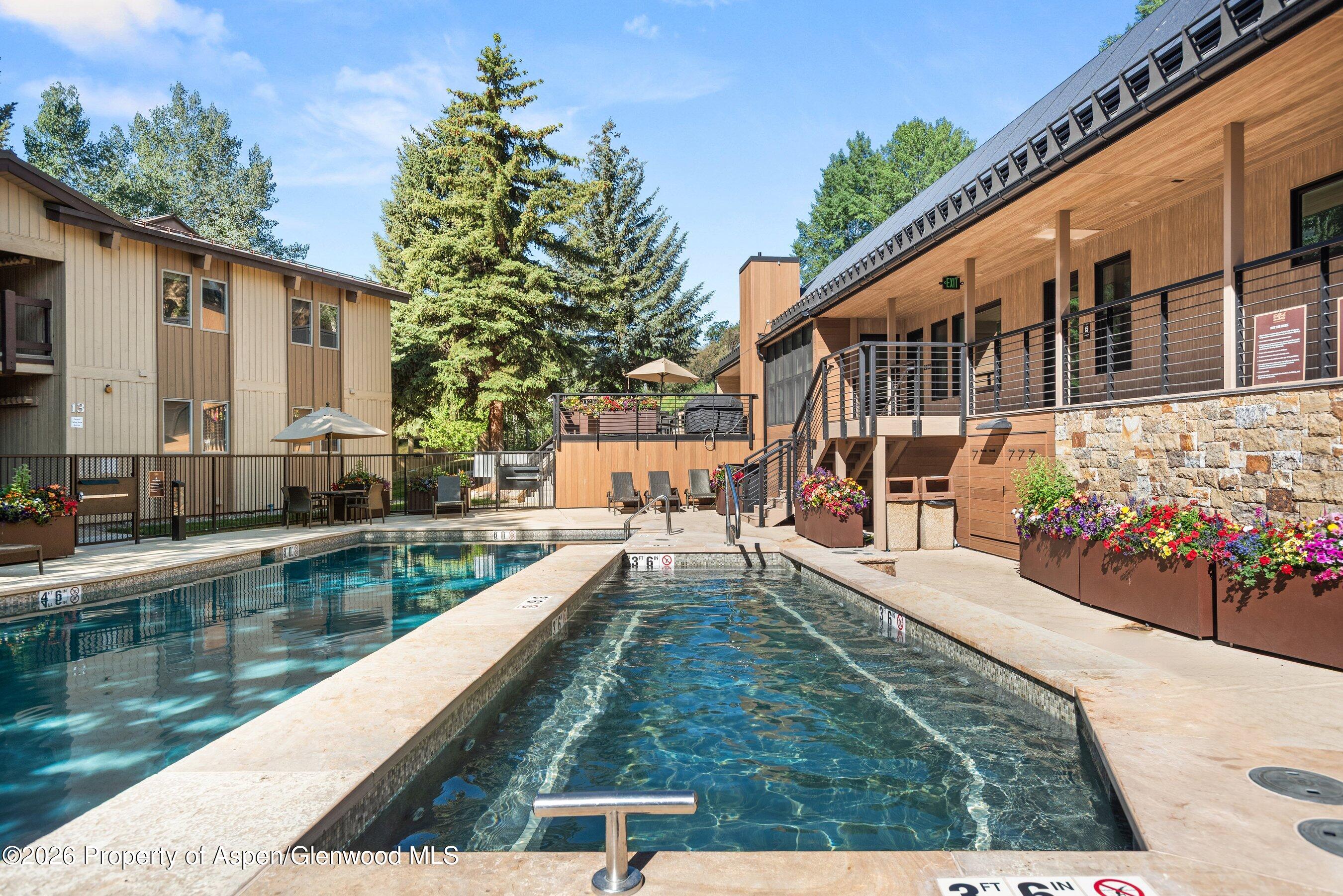 35 Upper Woodbridge Road, Unit 2A Snowmass Village, CO 81615 - Photo 31 of 34 a view of swimming pool from a balcony