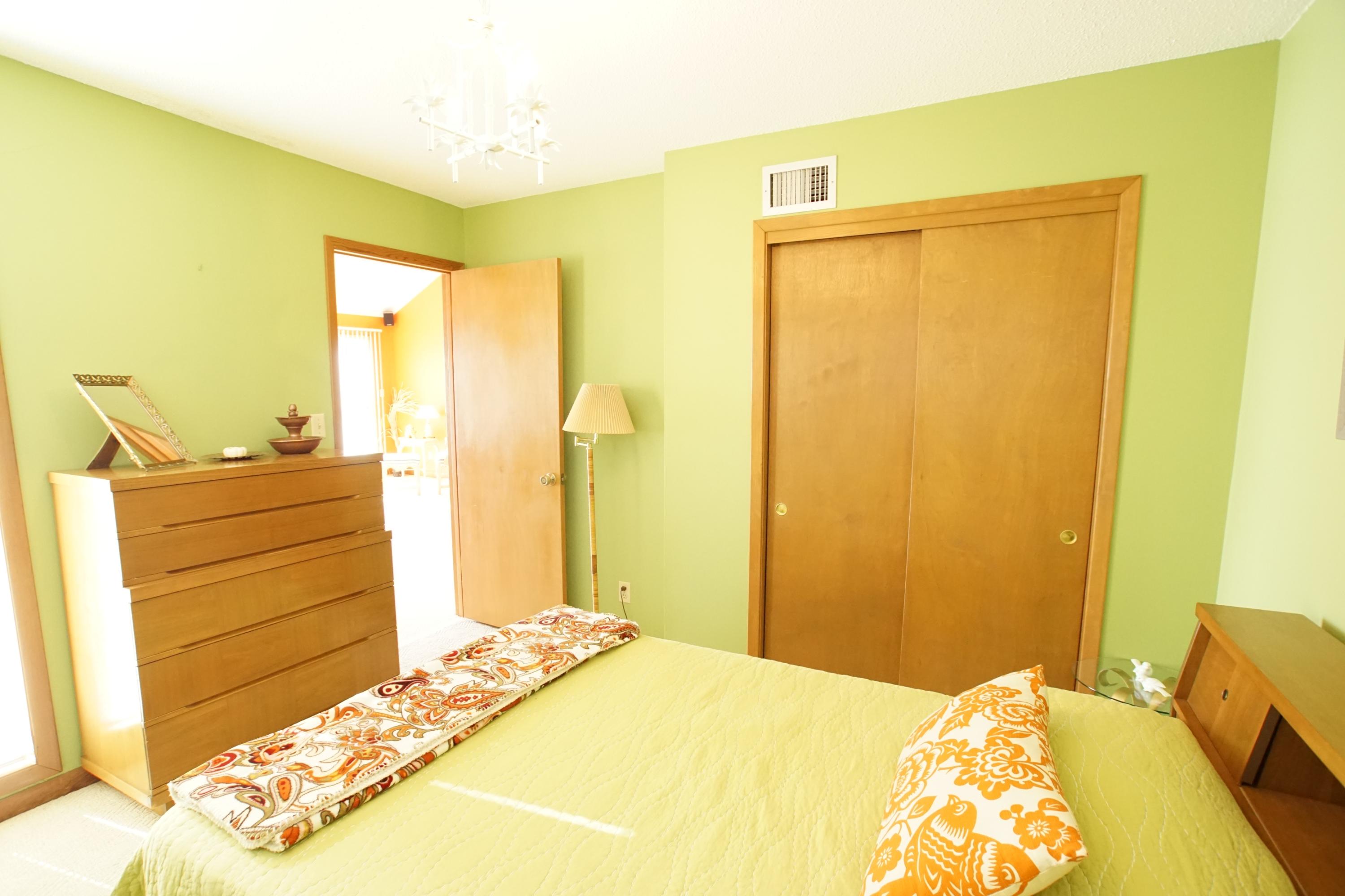 240 7th Street Santa Rosa Beach, FL 32459 - Photo 12 of 50 a bedroom with a bed and wooden floor