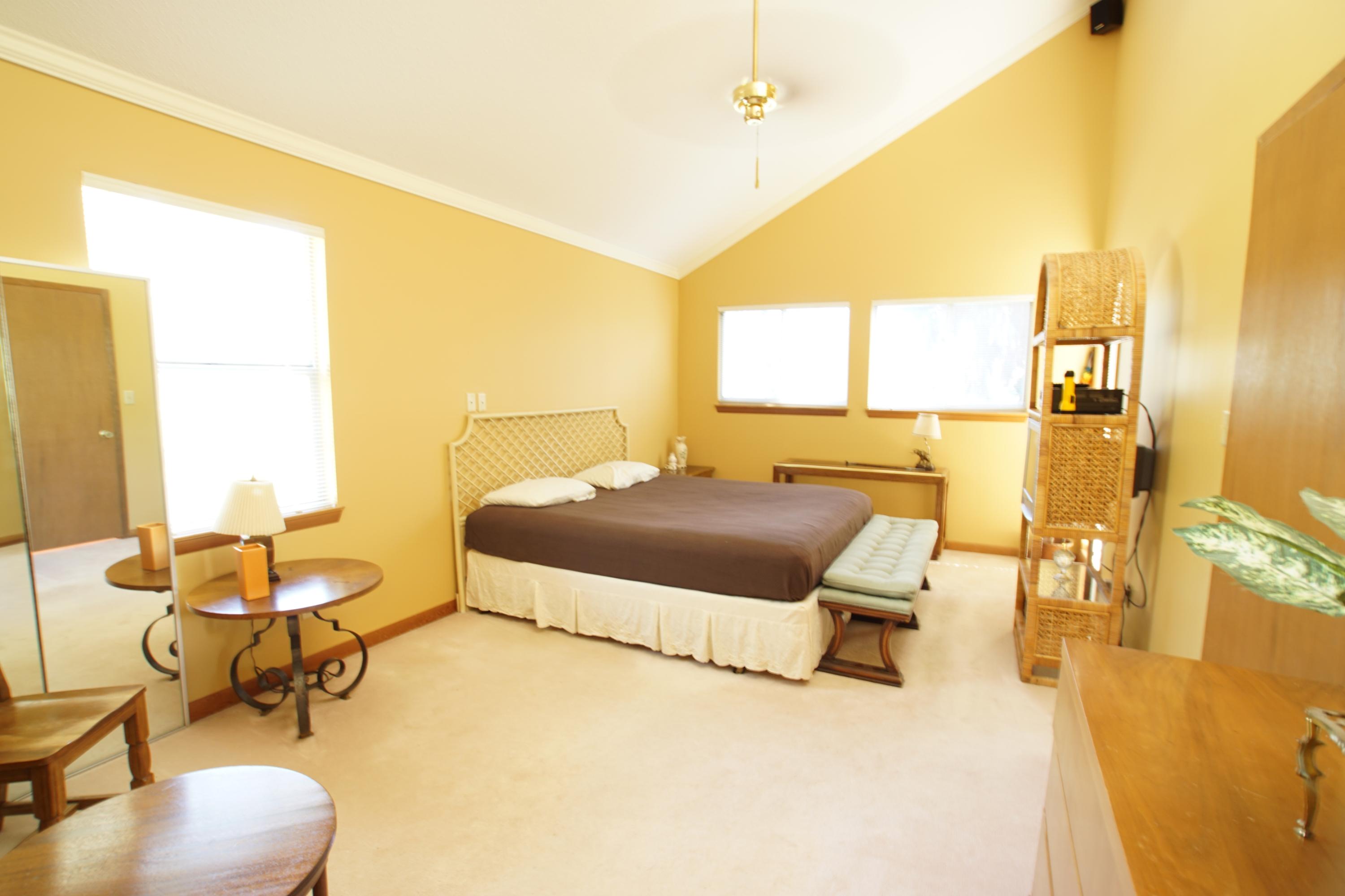 240 7th Street Santa Rosa Beach, FL 32459 - Photo 13 of 50 a bedroom with a bed and large windows