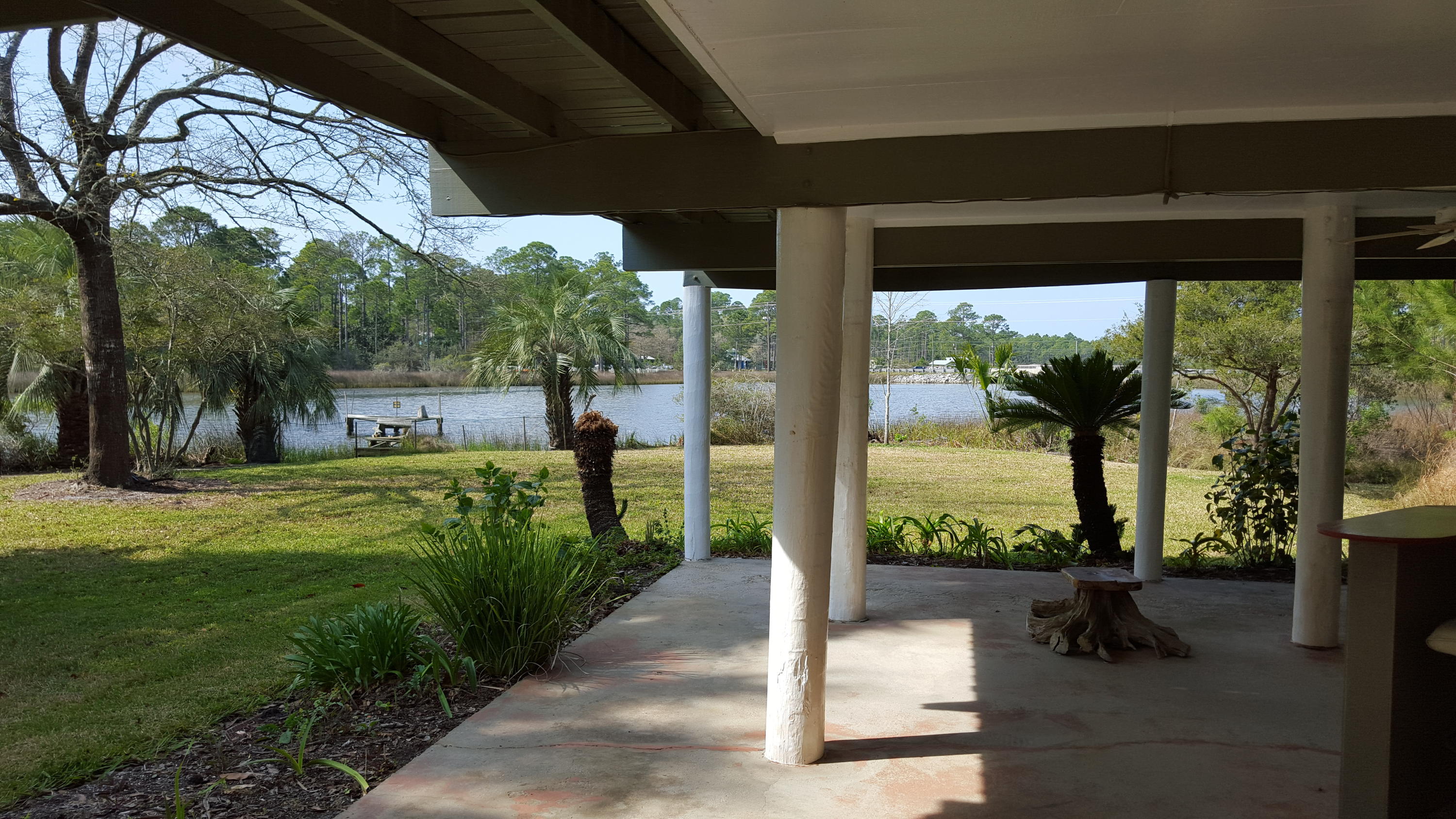 240 7th Street Santa Rosa Beach, FL 32459 - Photo 39 of 50 a view of a porch and garden