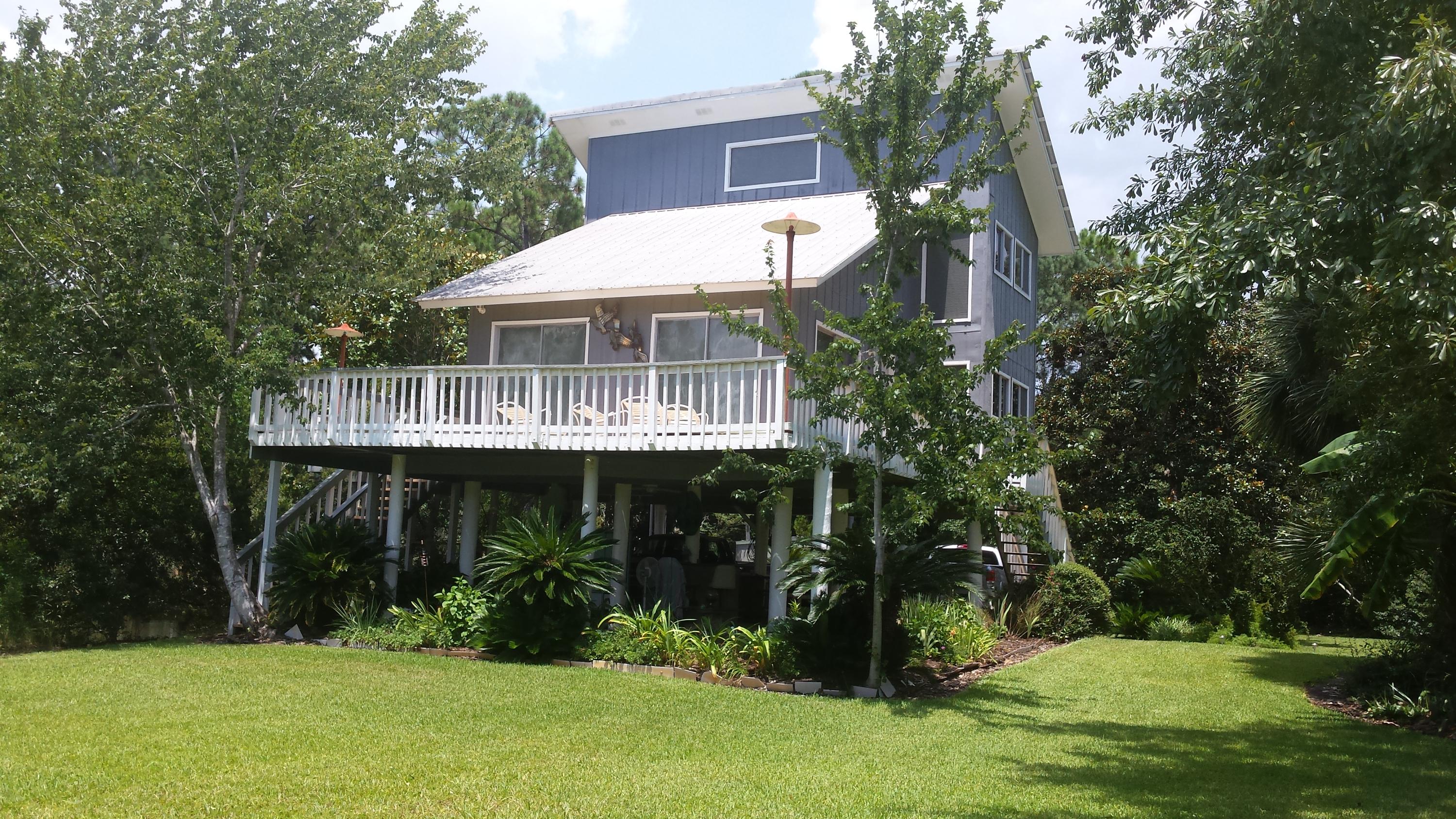 240 7th Street Santa Rosa Beach, FL 32459 - Photo 5 of 50 a view of house with yard and green space