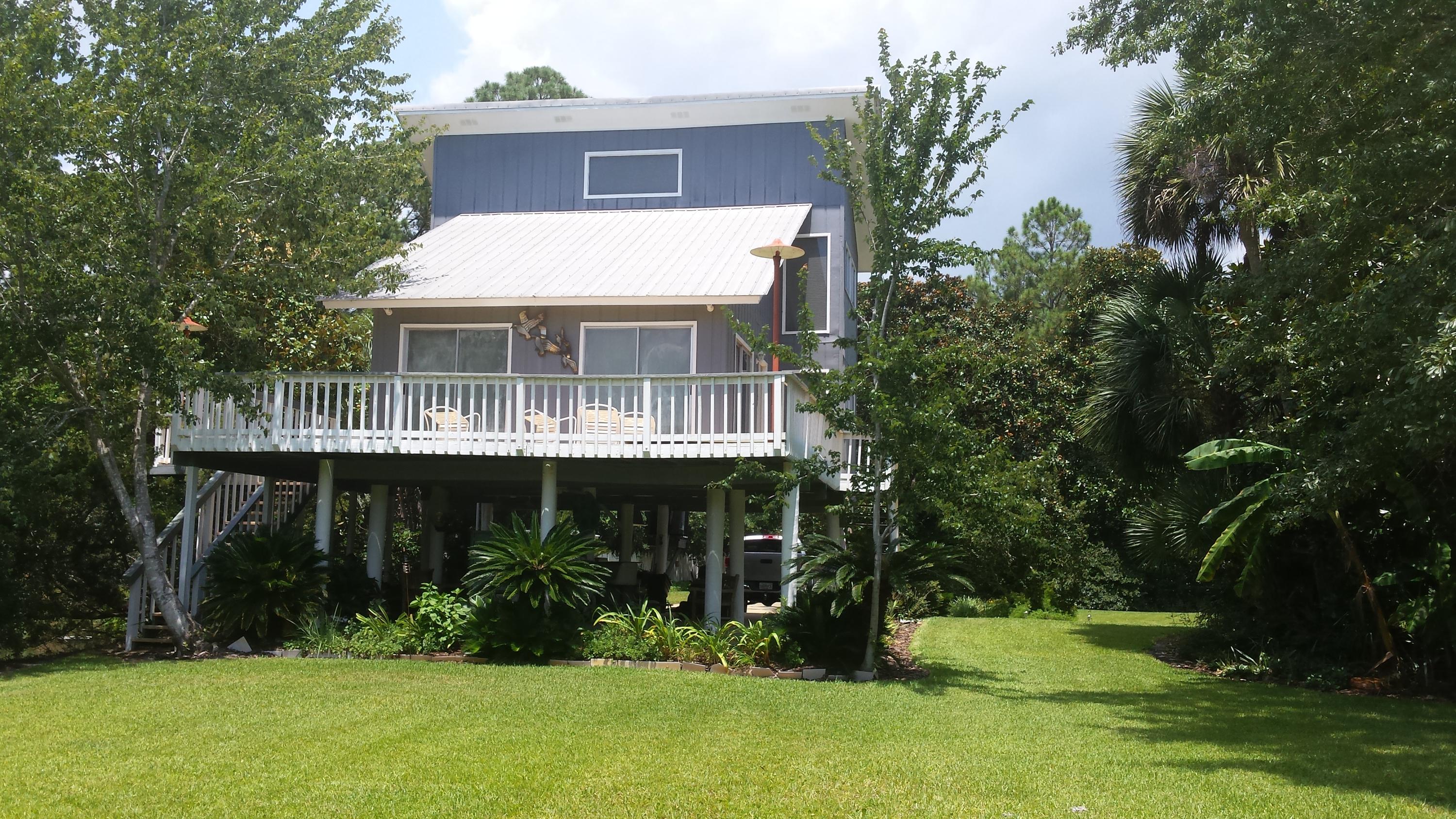 240 7th Street Santa Rosa Beach, FL 32459 - Photo 6 of 50 a front view of house with yard and green space
